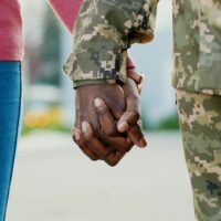 Military couple holding hands