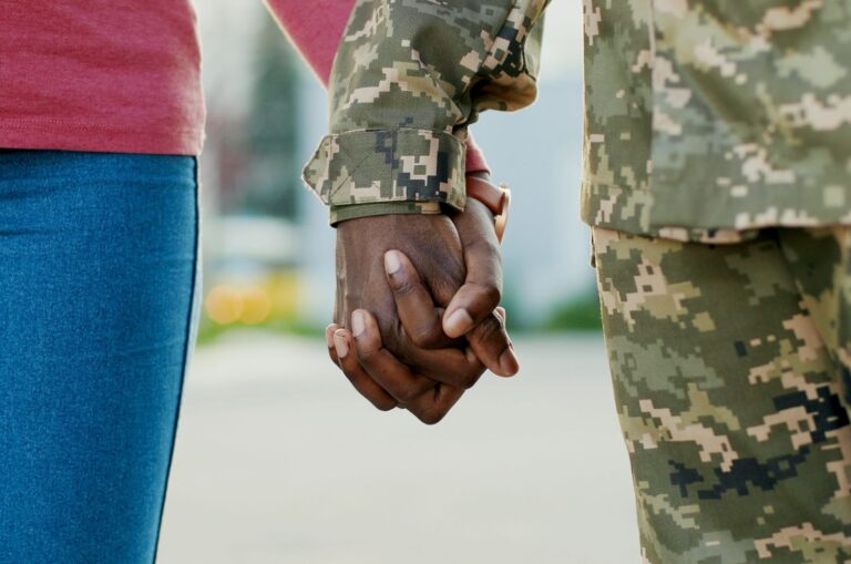 Military couple holding hands