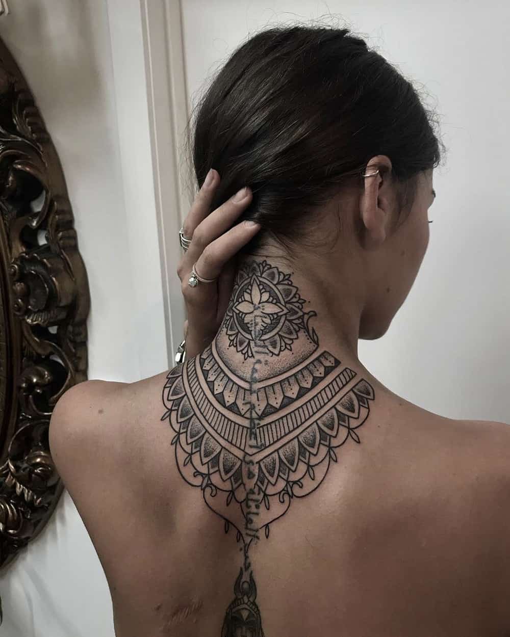 Feminine neck tattoo
