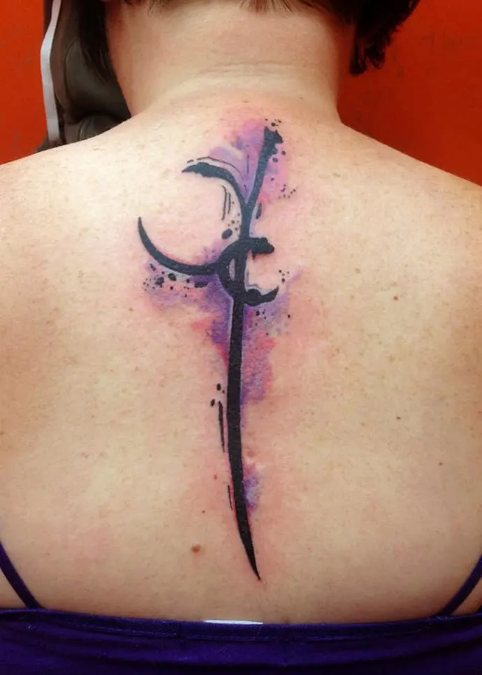 Feminine spine tattoo