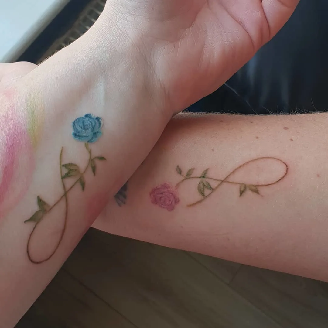 Infinity symbol and roses matching bestie tattoos