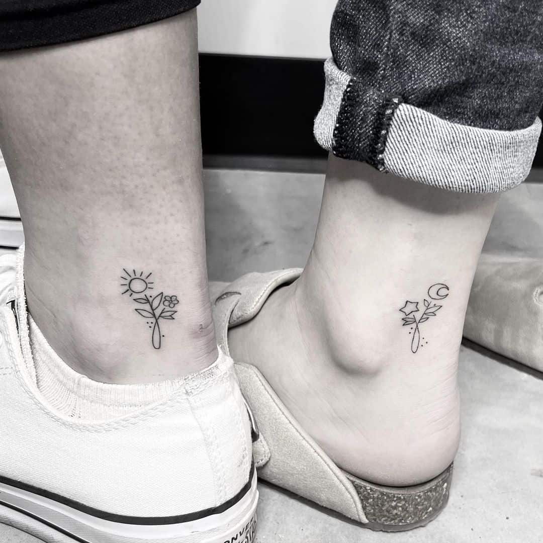 Sun and moon flowerish ankle tattoo