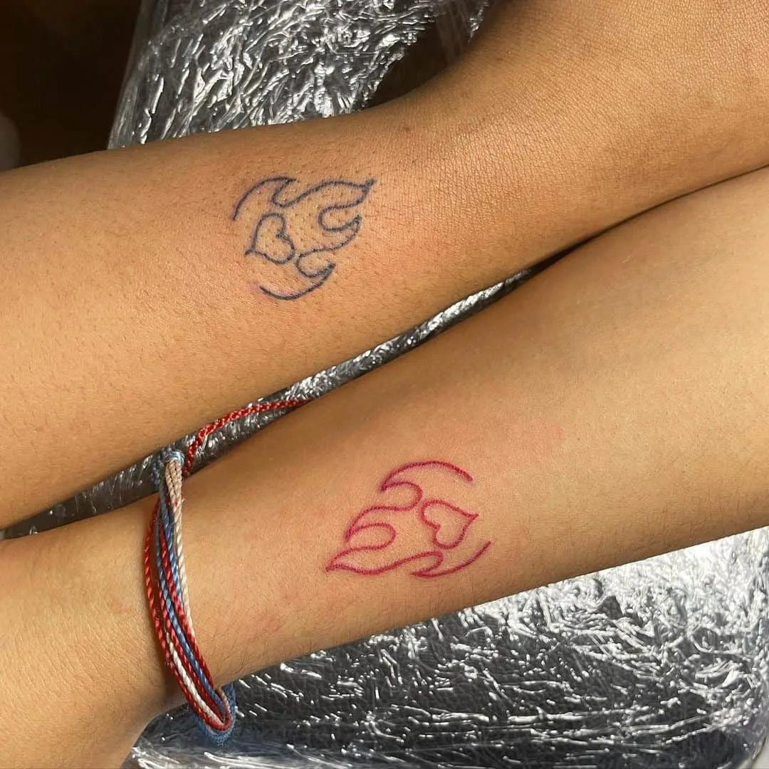 Twin flame heart matching tattoo design