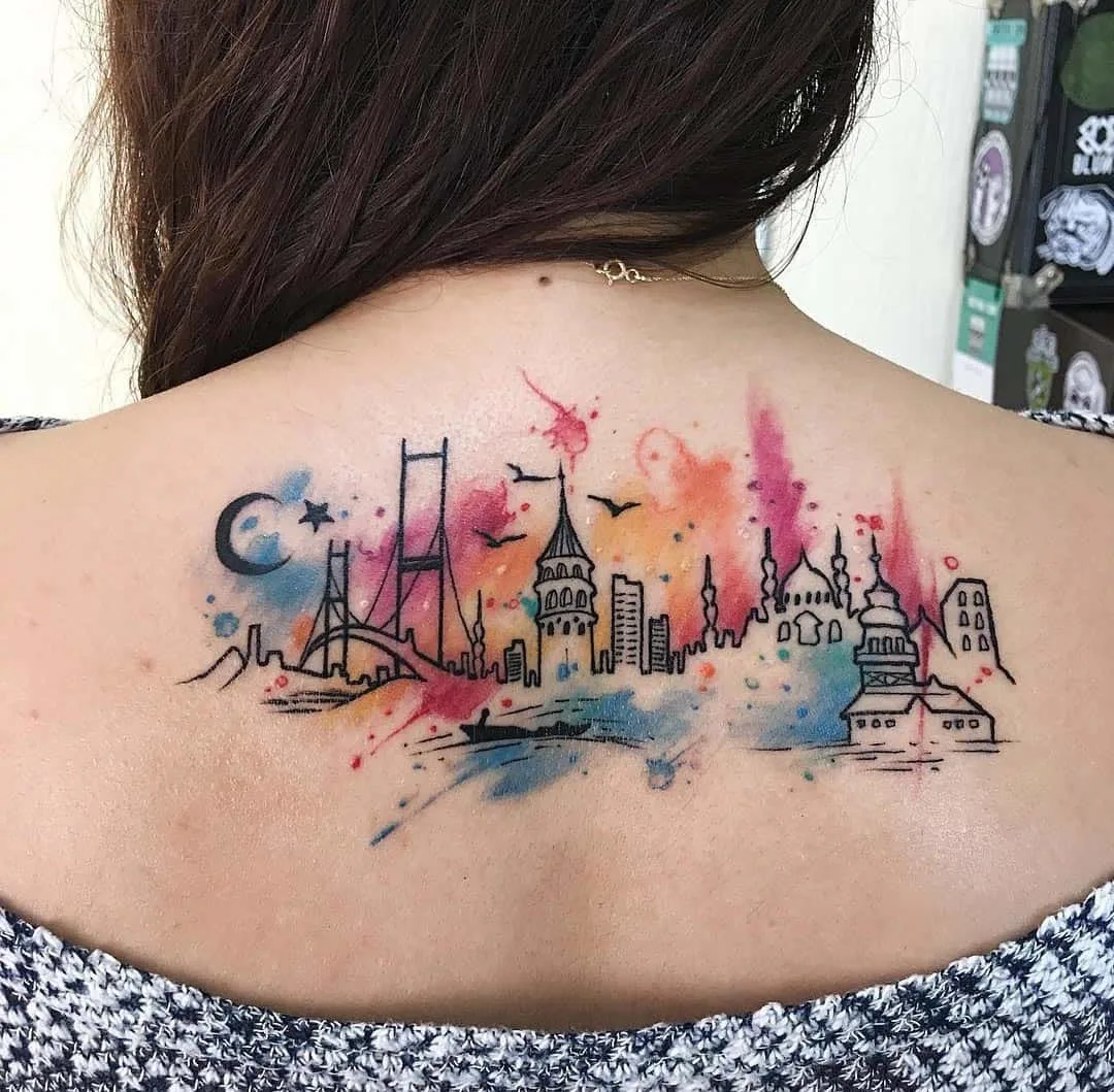 Watercolor skyline tattoo
