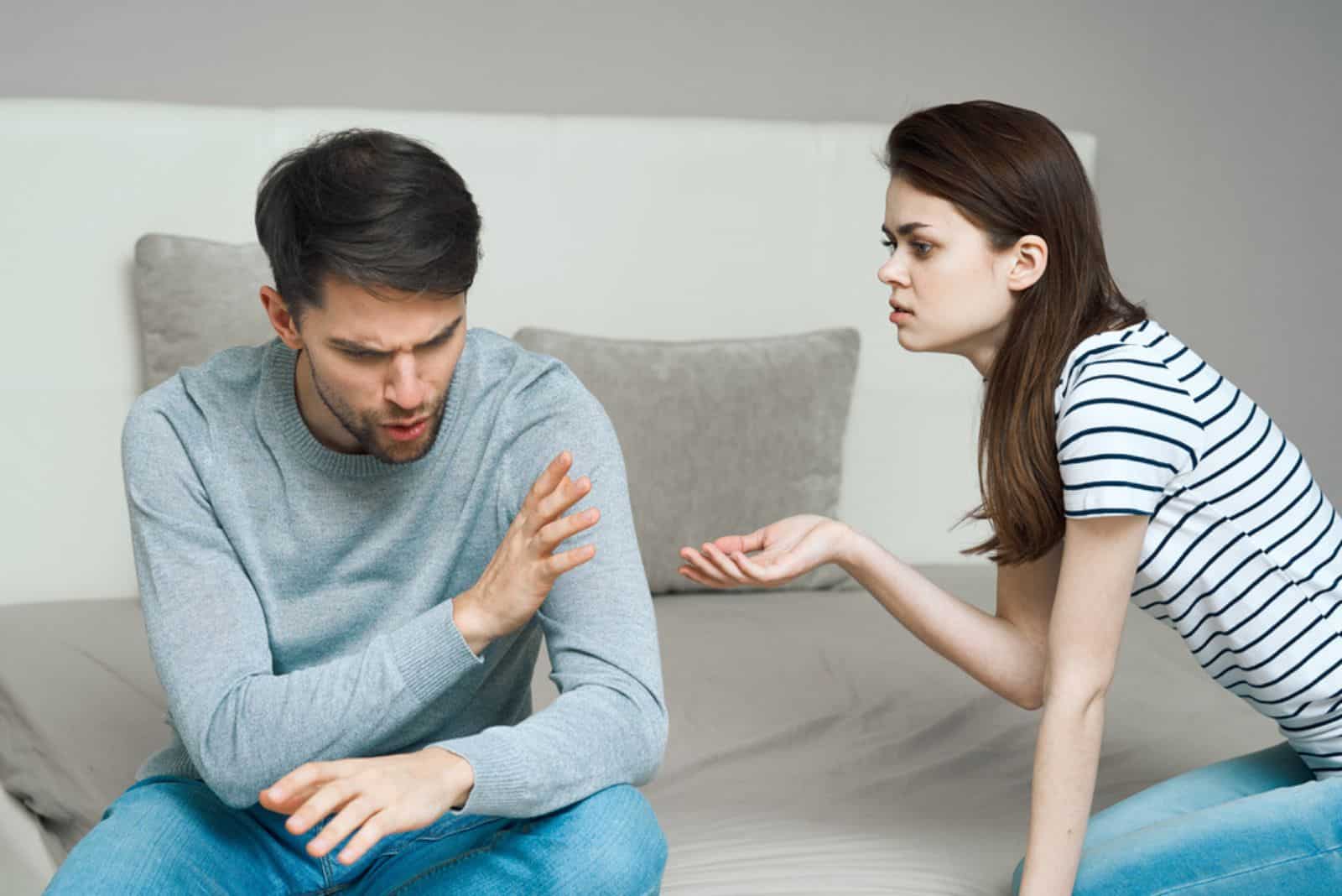 couple arguing in bed