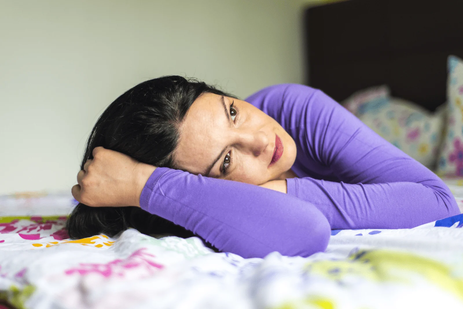 the imaginary woman is lying on the bed