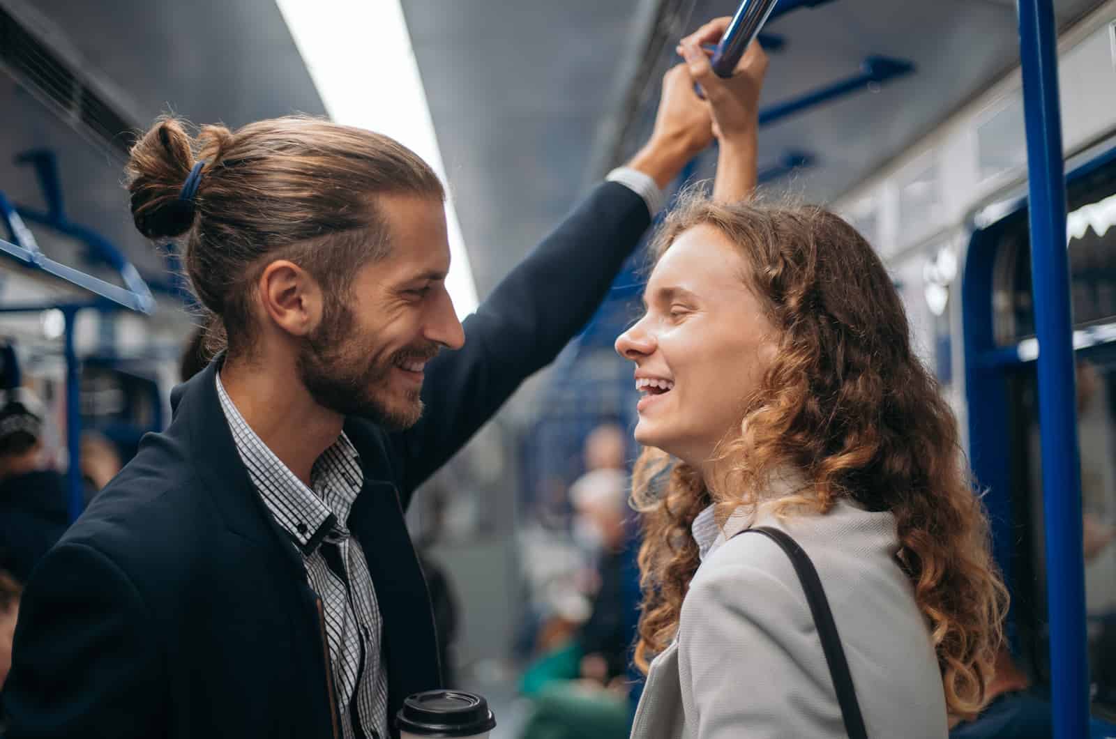 young couple talking in train