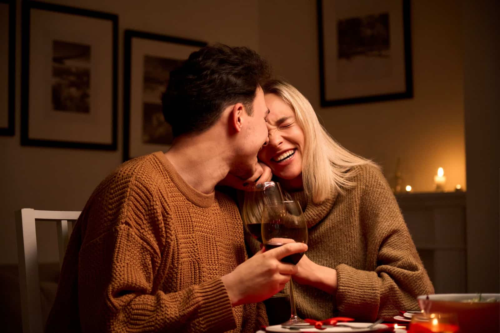 couple laughing together during dinner