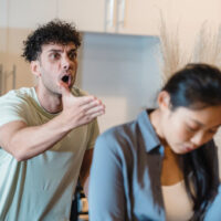 man shouting at woman which is a sign he has anger issues