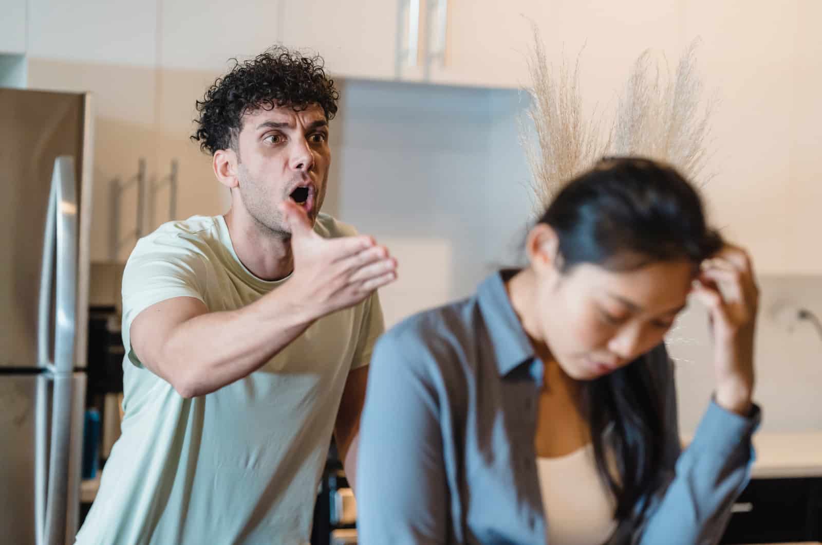 man shouting at woman which is a sign he has anger issues