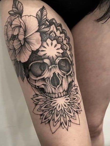 Floral skull sleeve tattoo