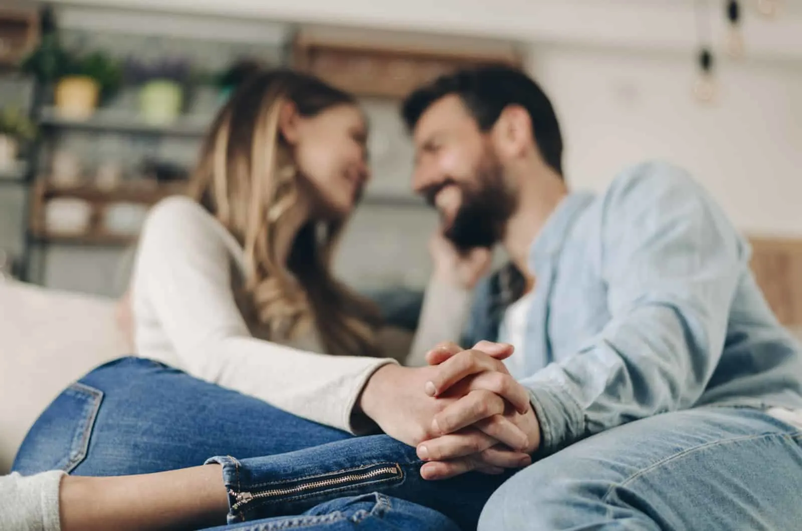 couple interlacing their fingers