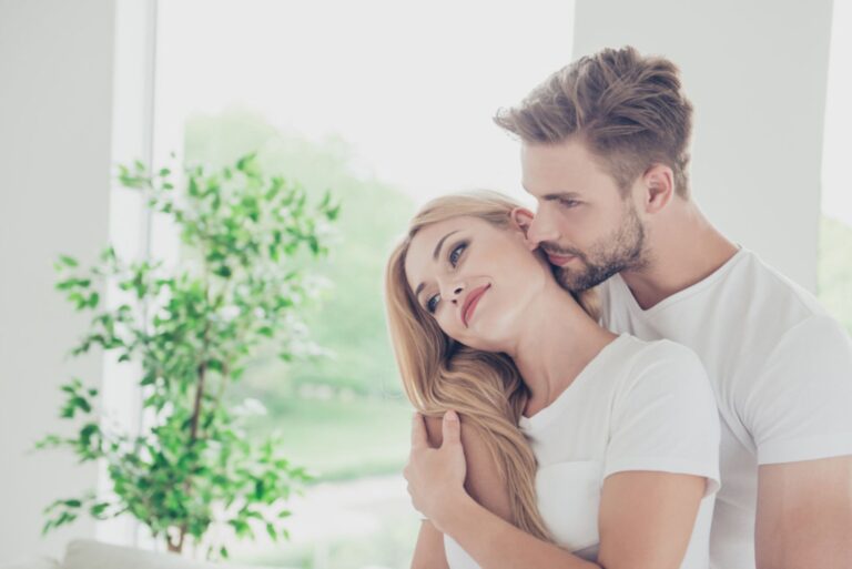 young couple hugging indoor