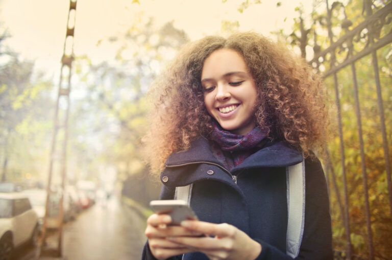 woman thinking about how exciting it is when someone says your name in a text