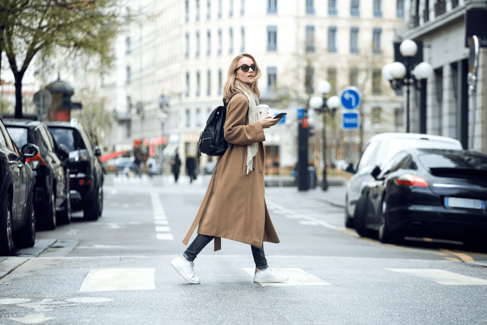 a woman walks down the street