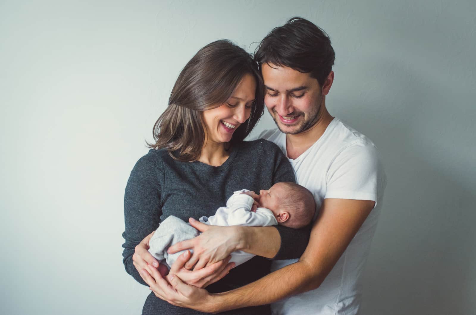 couple holding a newborn baby