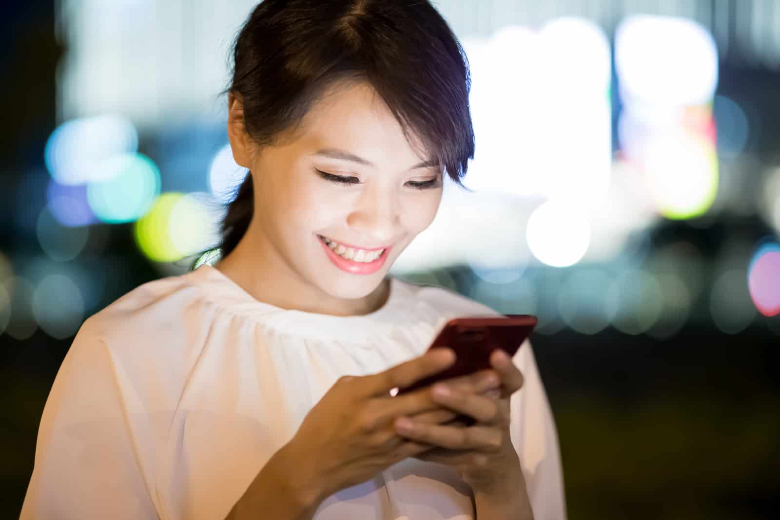 happy woman typing on phone (2)