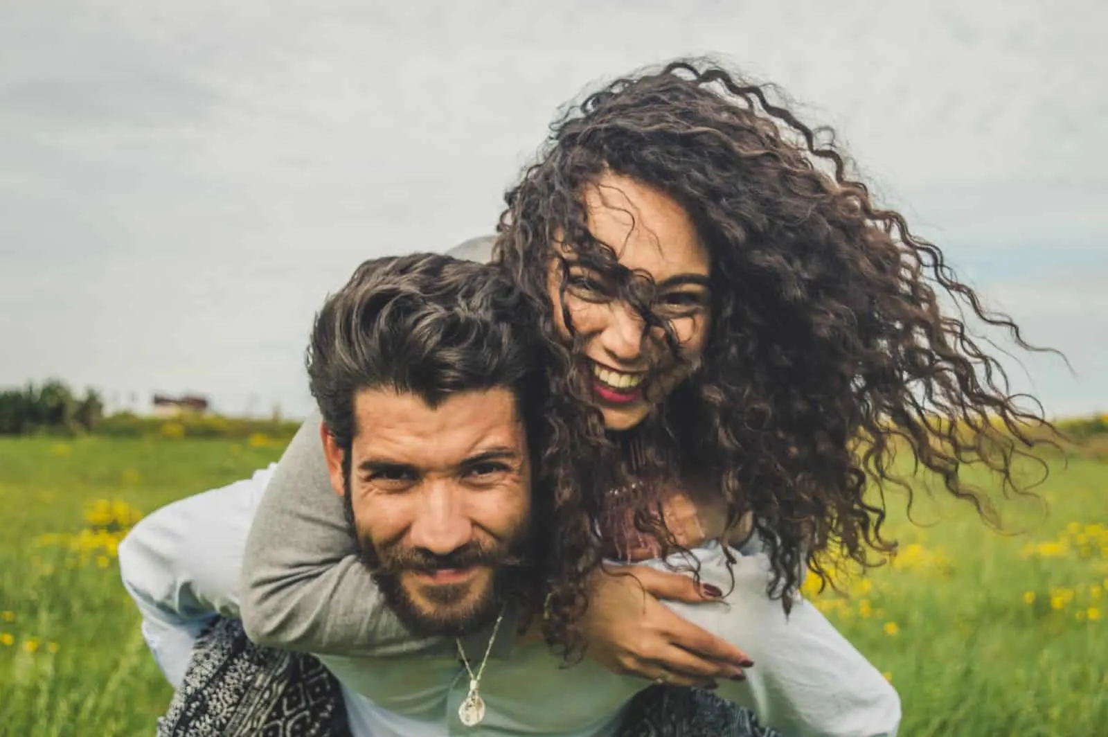 man carrying a woman on his back