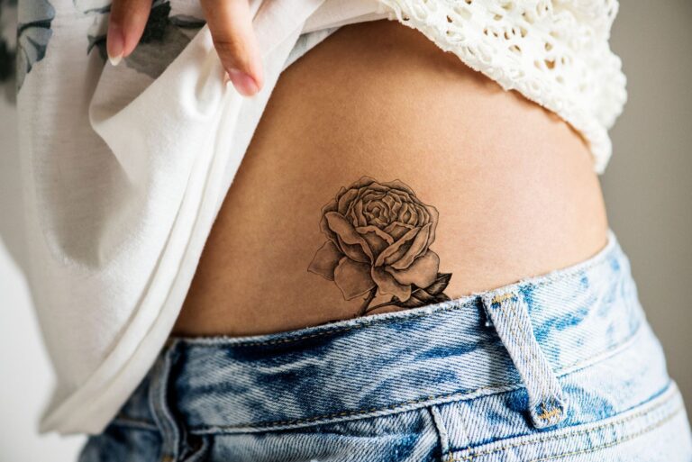 a woman with a tattoo on her stomach