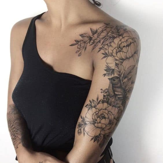 Bird and flowers sleeve tattoo