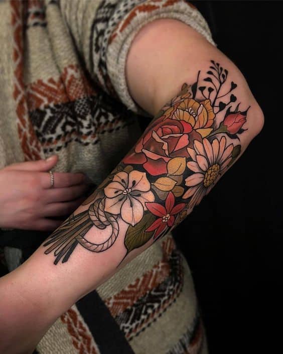Colorful rose forearm tattoo