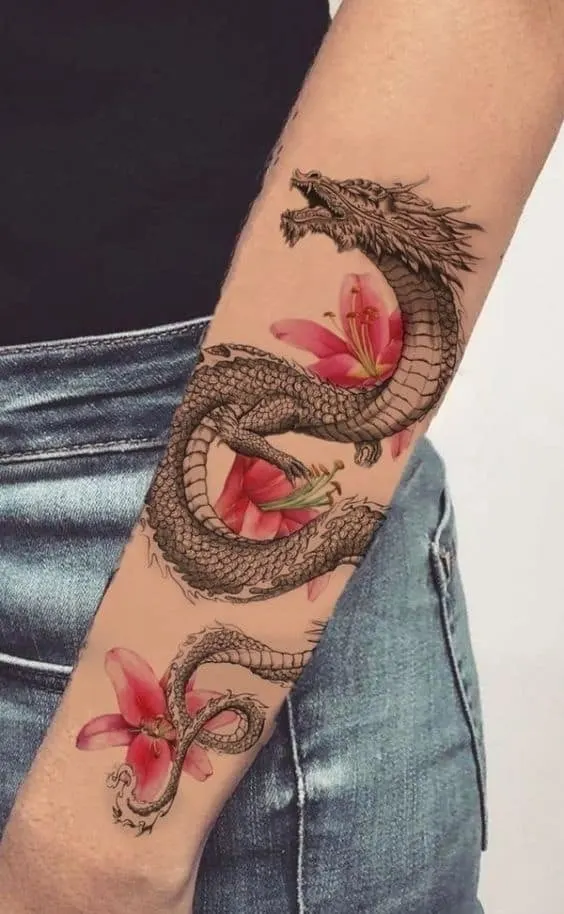 Dragon and flowers outer forearm tattoo
