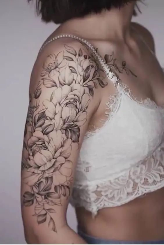 Female flower sleeve tattoo