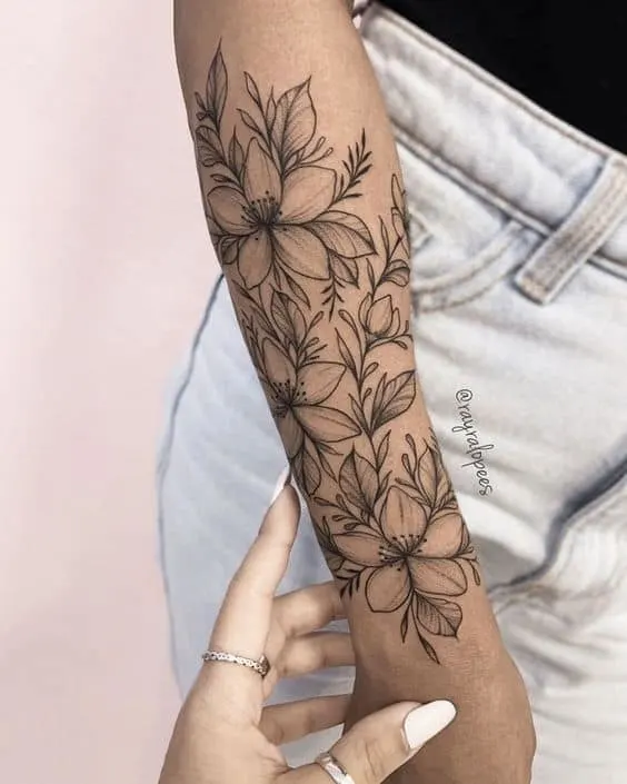 Floral forearm half-sleeve tattoo