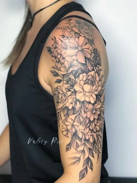 Floral upper arm tattoo for women