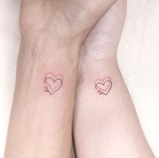 Matching hearts tattoo for sisters