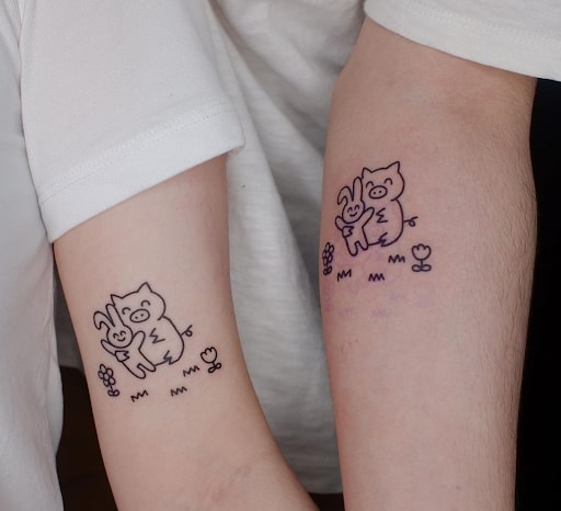 Tatuaje de cerdo y conejo