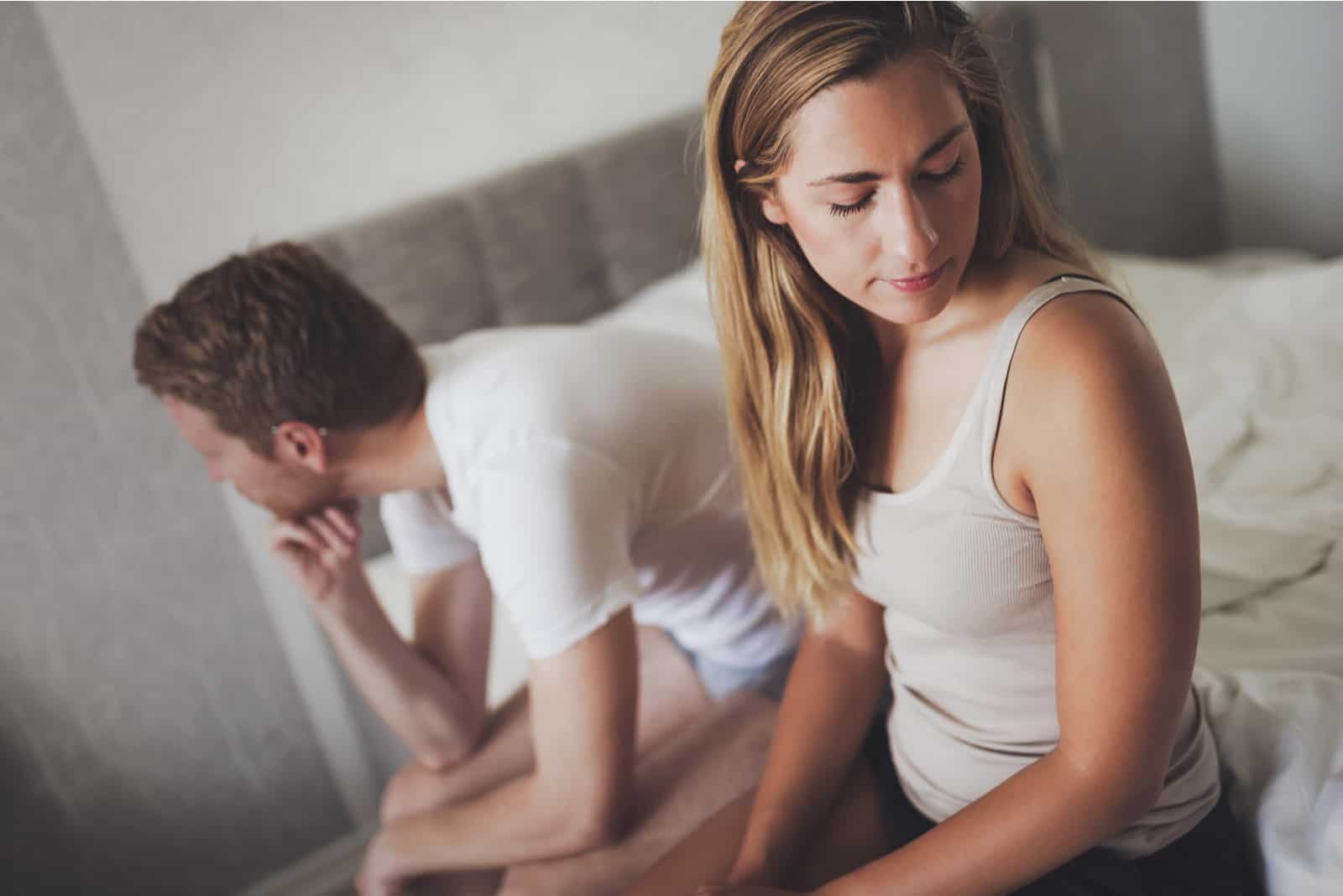 man and woman feeling regret after cheating