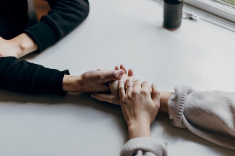 couple holding hands, partner supporting a highly sensitive person