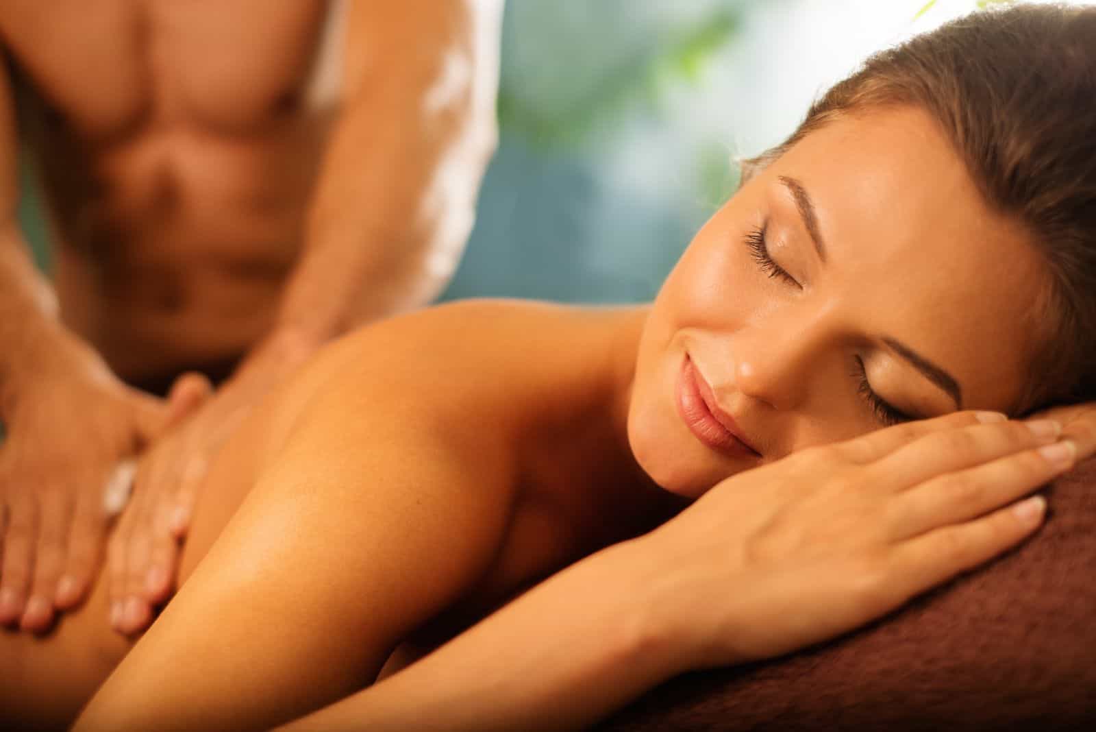 a man massages a woman