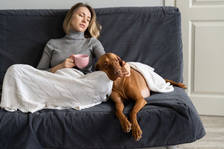 disappointed girl with a dog on the couch