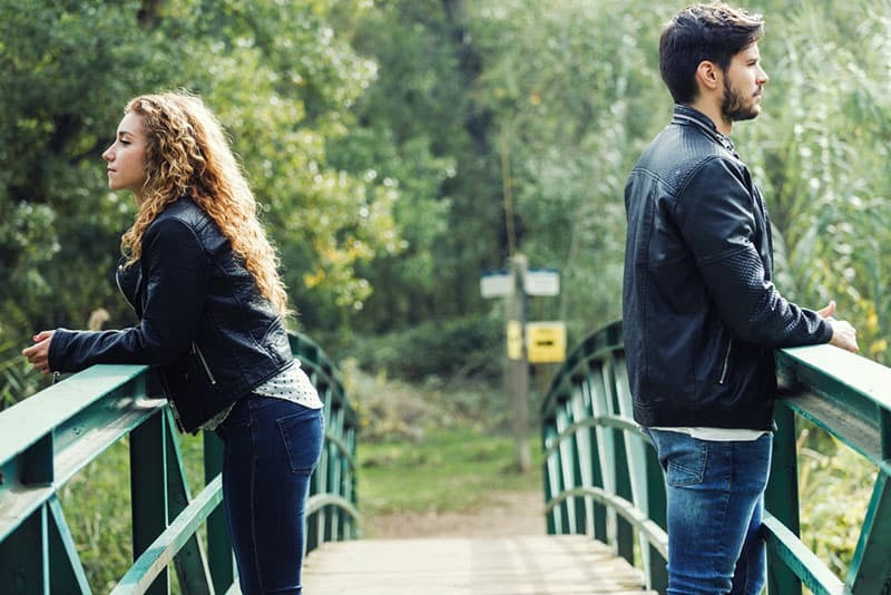 couple in conflict on the bridge