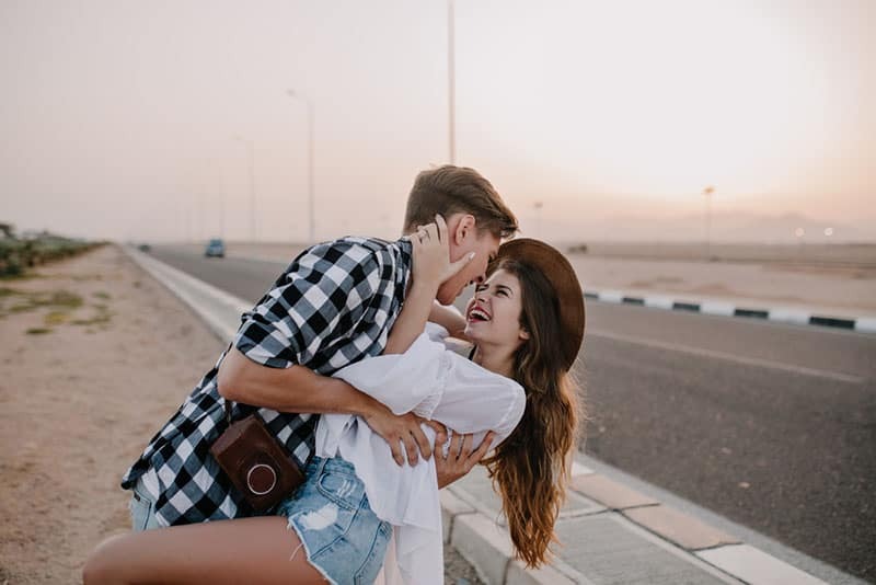 laughing couple on the road