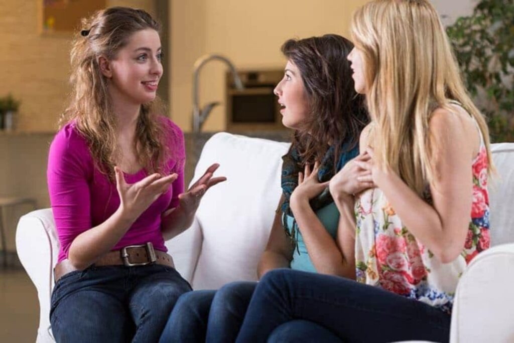 thrilled woman talks with friends