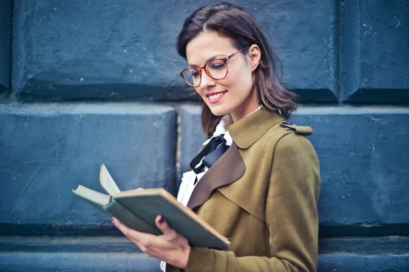 young woman reads a book