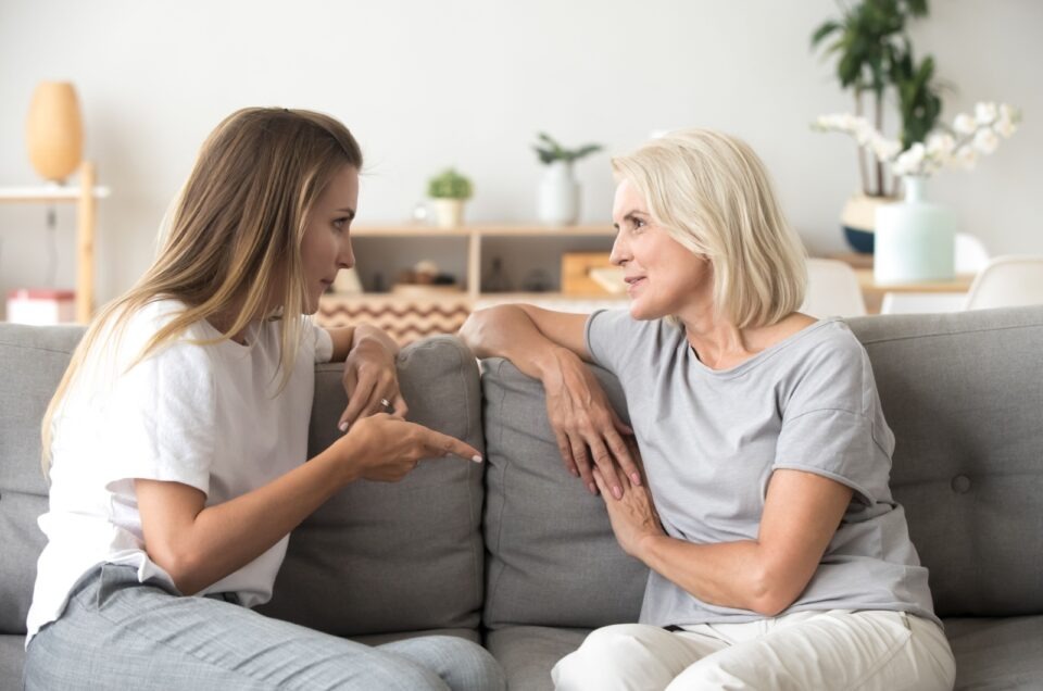 young woman talking to senior