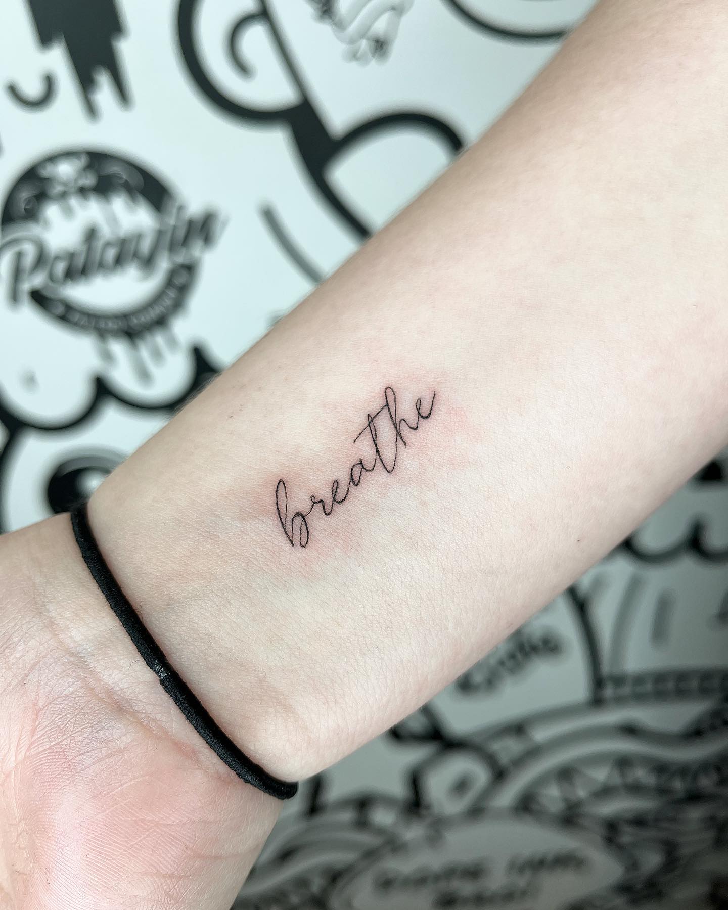 breathe script tattoo