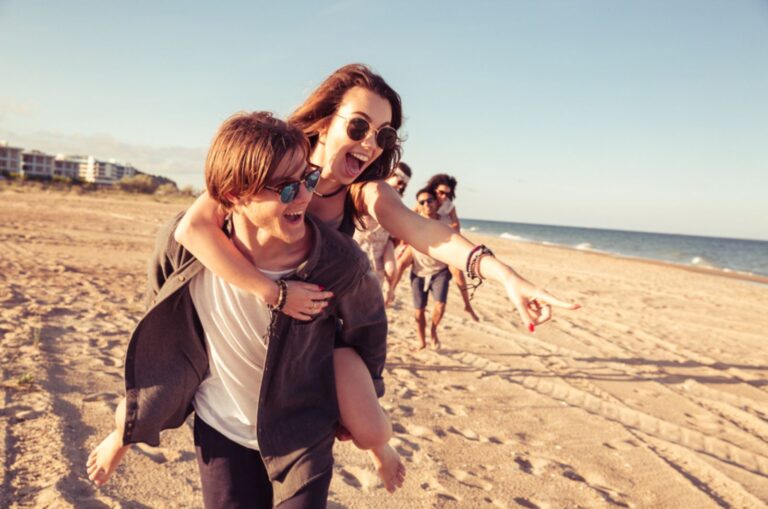 man giving a piggy ride to a girl