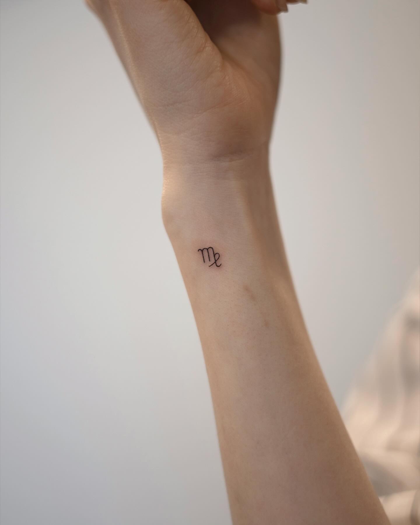 tiny zodiac tattoo