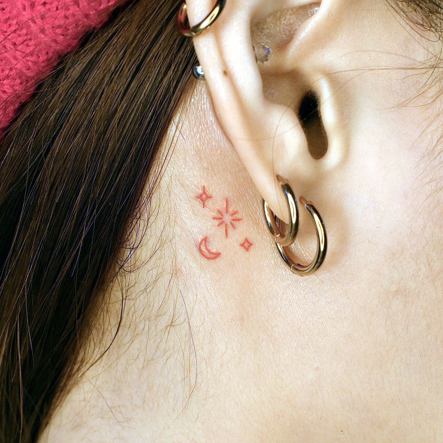 tiny ear tattoo