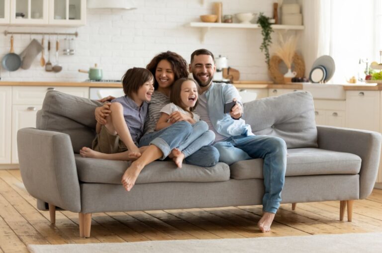 family posing on the couch