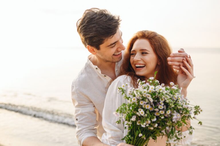 man surprising woman with flowers