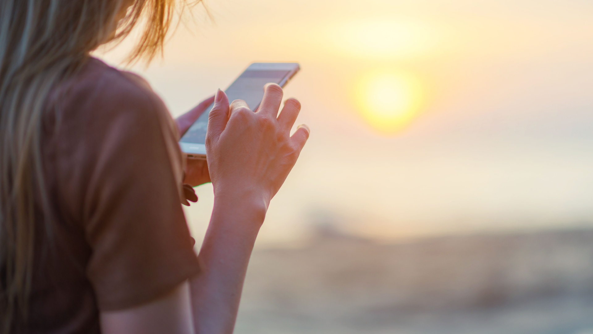 woman reading on a phone