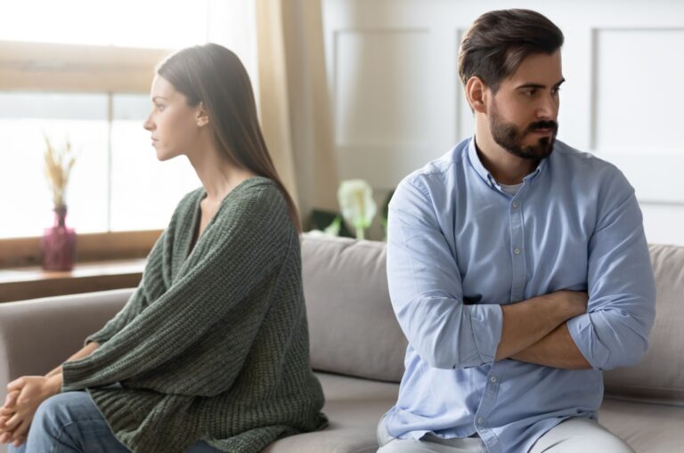 angry couple sitting on couch