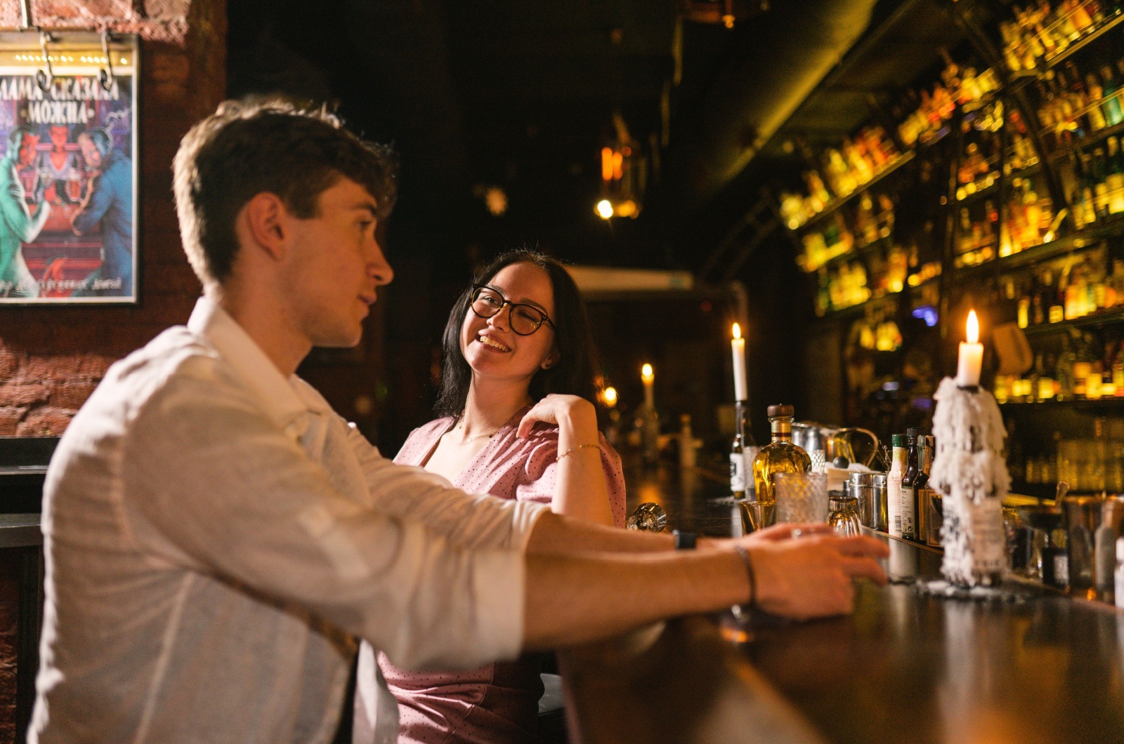 man and woman talking in bar