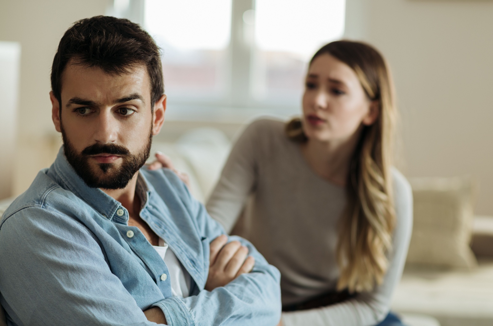 man not paying attention to woman